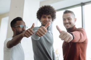 men putting a thumbs up